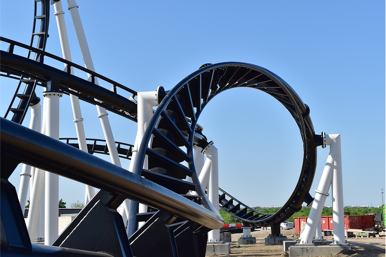 Get ready to scream! Image shows a thrilling roller coaster loop.